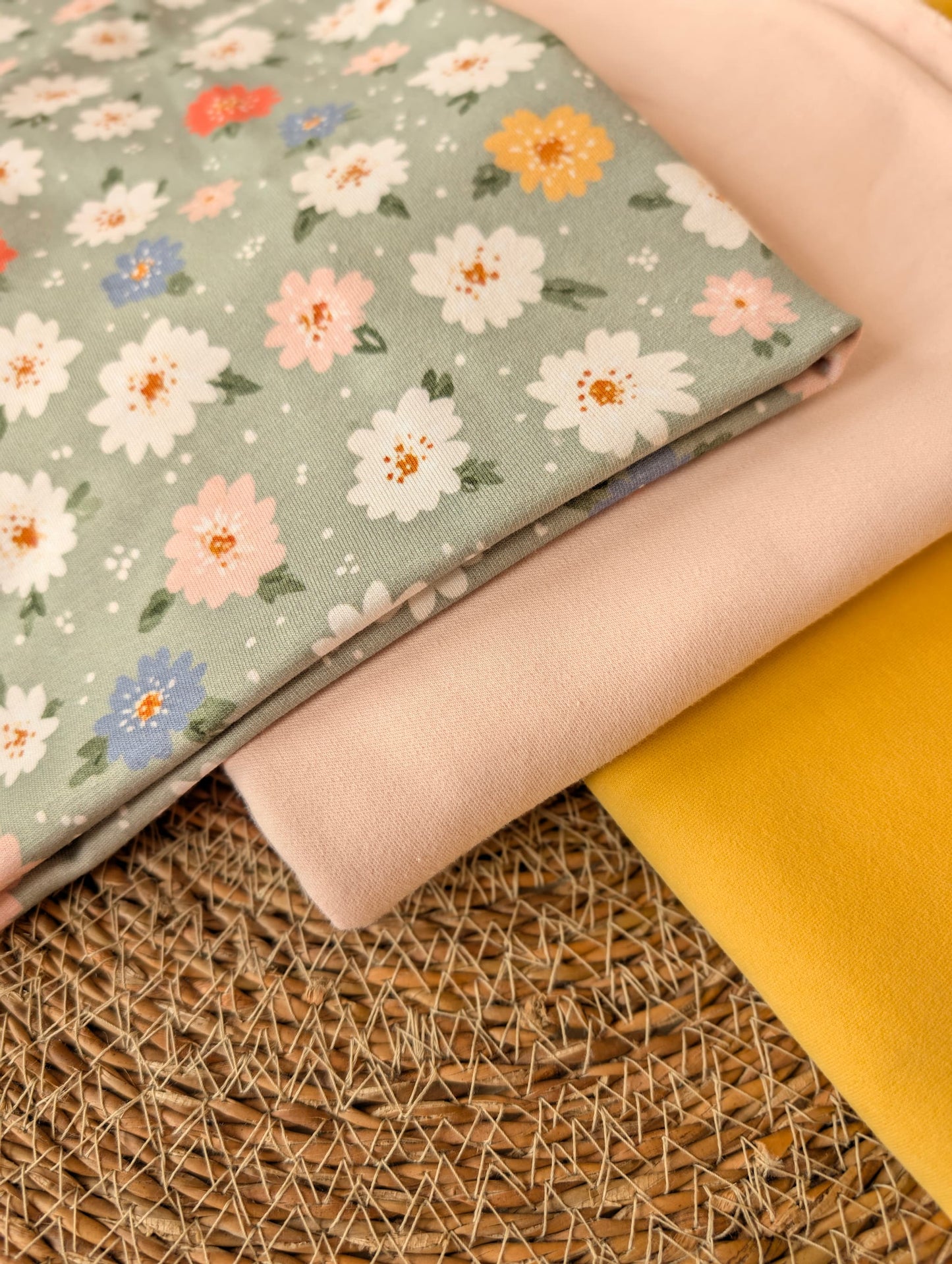 Close-up of Daisy Floral Cotton Jersey Sage — daisy and leaf print detail on muted sage green cotton jersey — Esorai