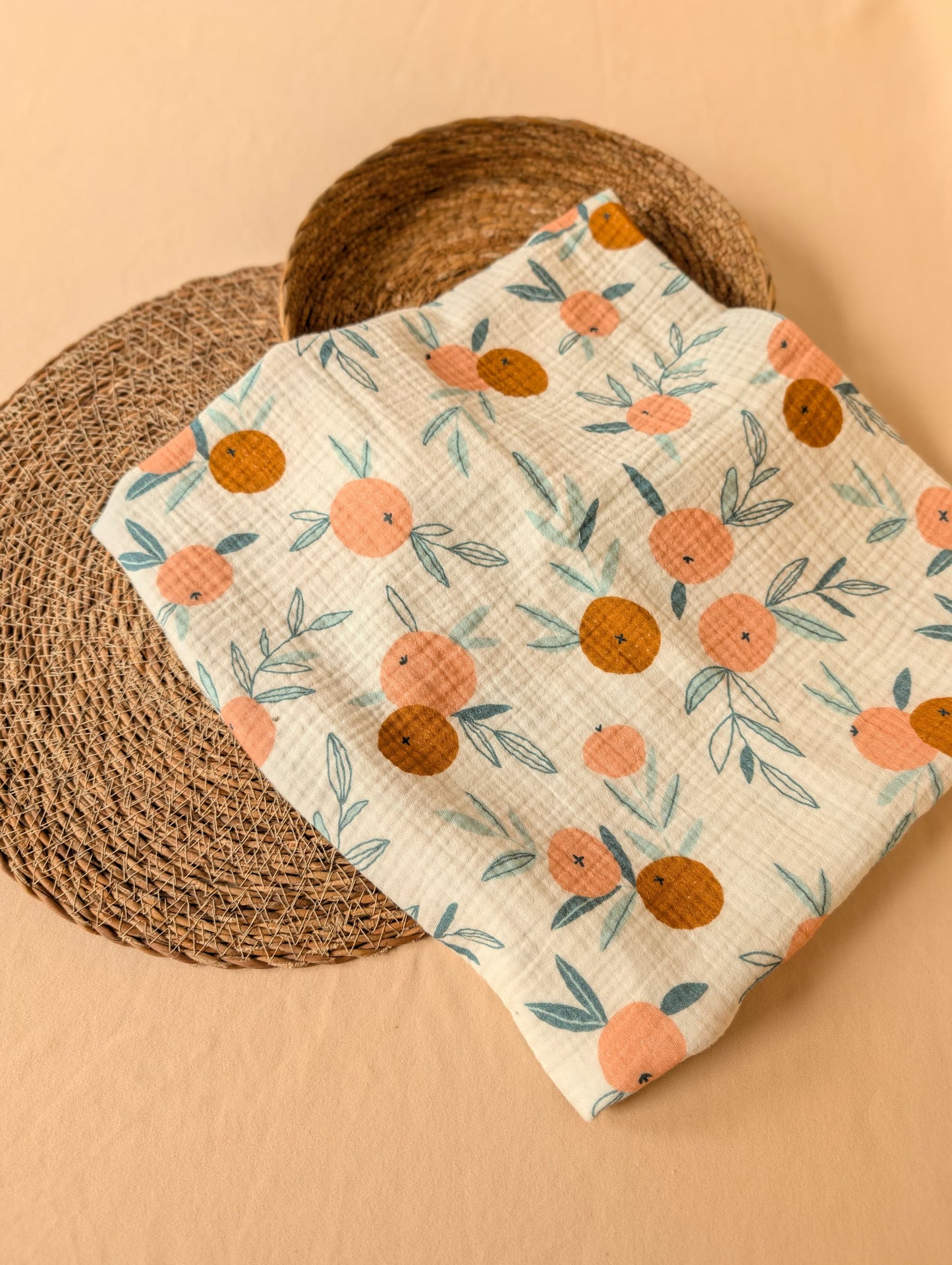 Floral patterned fabric on a woven mat with a beige background